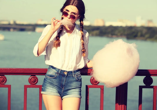 girl eating candy floss